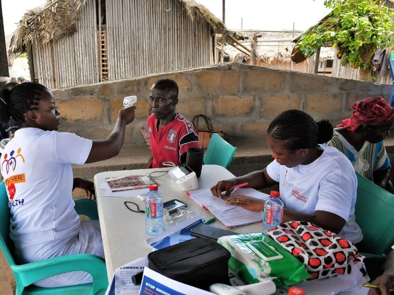 nurses checking patient temperature