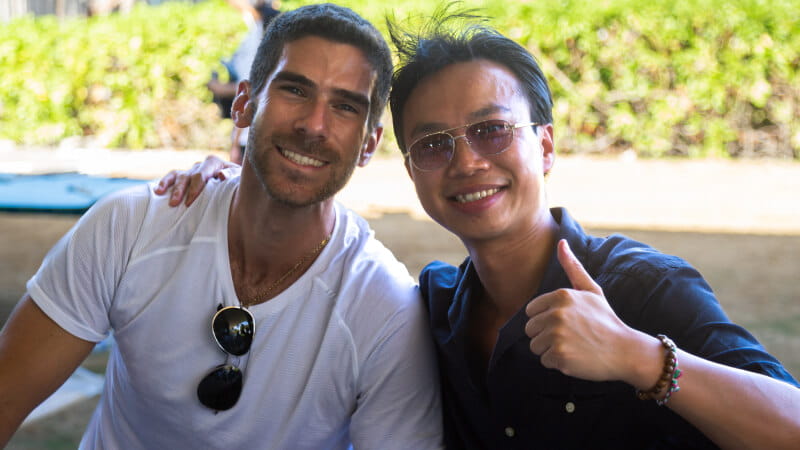 Two employees smiling at the camera