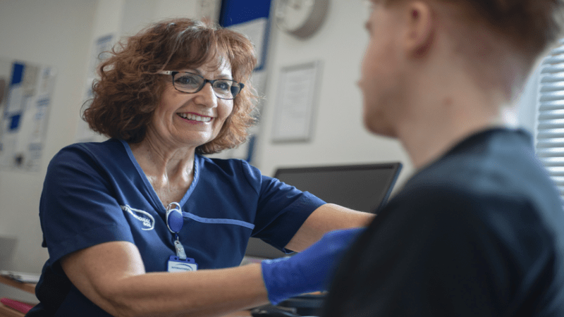 Doctor with a patient giving vaccine